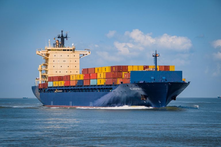 Container ship loaded with shipping containers at sea