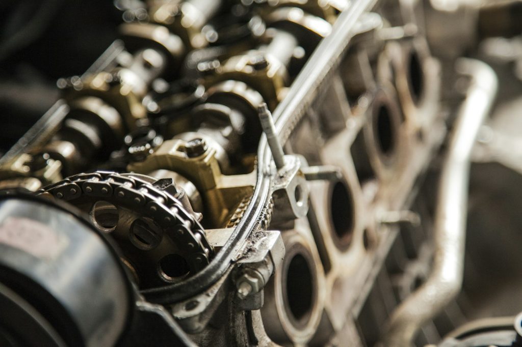 Close-up of a stripped car engine block with cam chain
